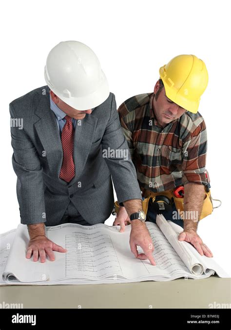 An Engineer And A Construction Foreman Reviewing Blueprints Isolated