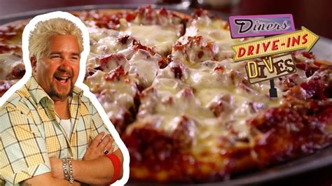 Guy Tries A Dynamite Meat Lovers Pizza Diners Drive Ins And Dives