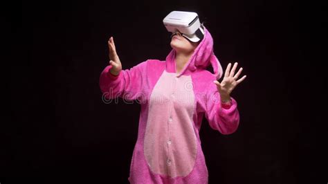 Girl In Pink Pajamas Kigurumi In Vr Glasses On A Black Background Pajama Party Stock Image