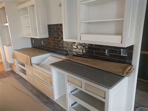 This dark grey quartz countertop has accents of a medium heather grey. Pin on House build