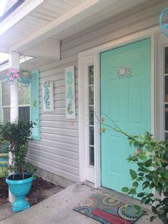 Front doors say so much about a home. Image result for gray house white trim turquoise shutters | House paint exterior, House colors ...