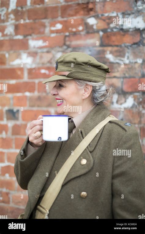 Lady Dressed In British Army 1940 Vintage Uniform Drinking Tea From A