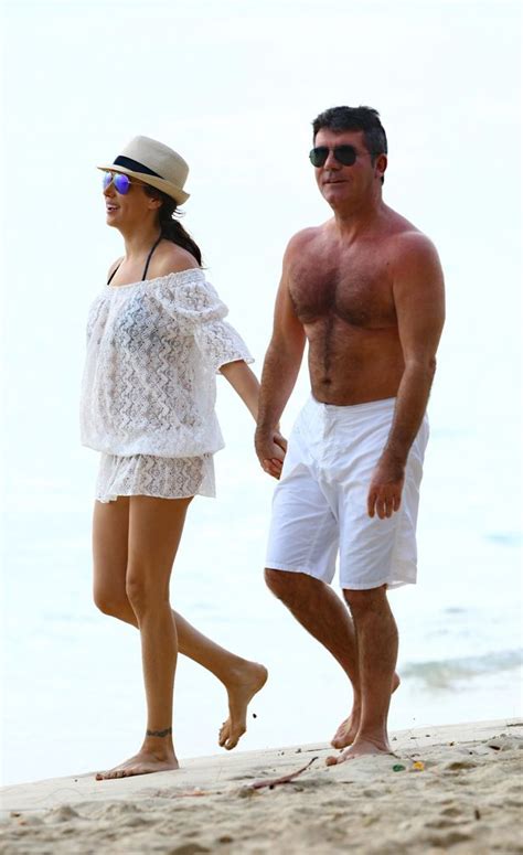 simon cowell and lauren silverman pack on the pda on romantic beach