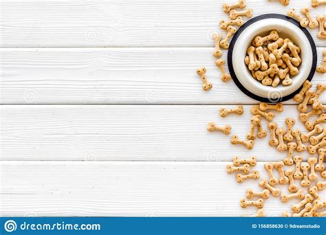 Dog Dry Food In Bowl On White Wooden Background Top View Mock Up Stock