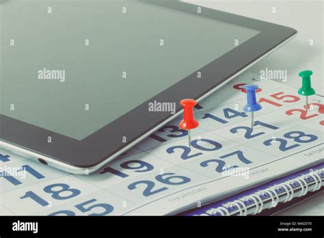 Wall Calendar With Pen And Tablet Stock Photo Alamy