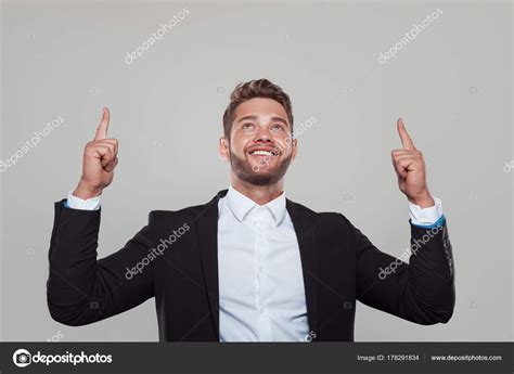 Content Businessman Pointing Up — Stock Photo © Kegfire 178291834