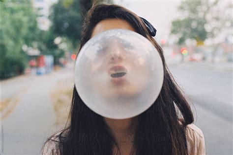 Girl Blowing A Bubblegum By Vertikala