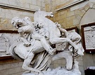 a statue of a man riding on the back of a horse