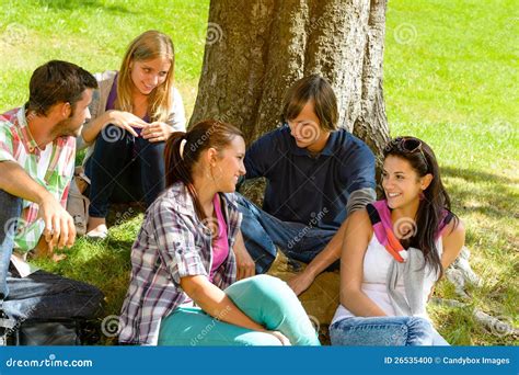 Students Sitting In Park Talking Smiling Teens Stock Photo Image Of