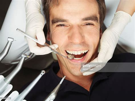 Man Receiving Dental Examination High Res Stock Photo Getty Images