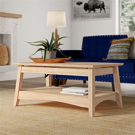 Just add a sofa and a couple of chairs and your living room is complete. Mistana™ Lynn Solid Wood Lift Top Extendable Coffee Table ...