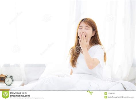 Beautiful Of Portrait Young Asian Woman Yawn Sitting With Sleep On Bed