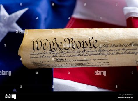 A Copy Of The United States Of America Constitution Scroll In Front Of