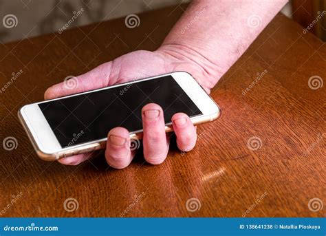 Hand Picking Up Mobile Phone From Table Stock Photo Image Of Display