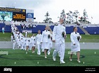 U.S. Naval Academy graduates enter Navy-Marine Corps Memorial Stadium ...