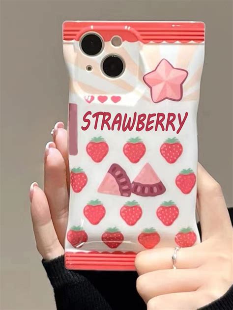 A Woman Holding Up A Phone Case With Strawberries On It And The Words