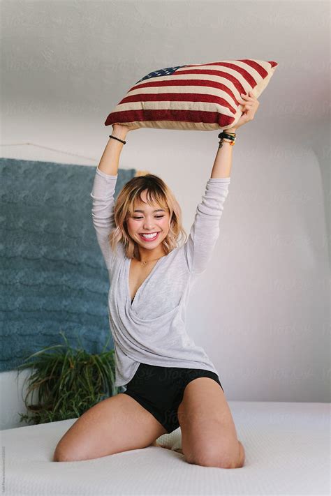 Woman With American Flag Pillow By Stocksy Contributor Leah Flores Stocksy