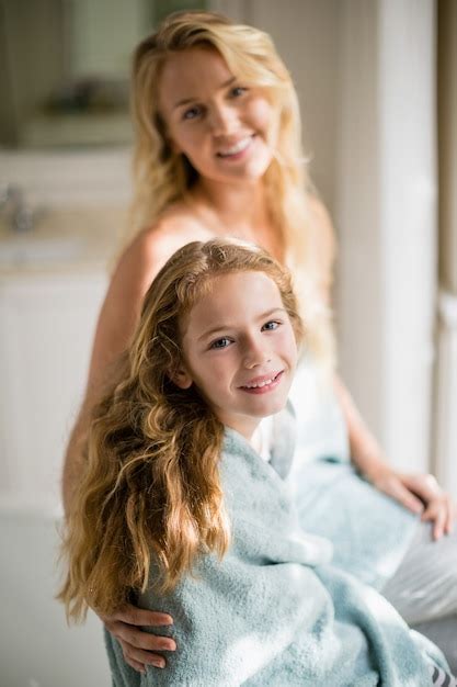 Premium Photo Smiling Mother And Daughter In Towel At Bathroom