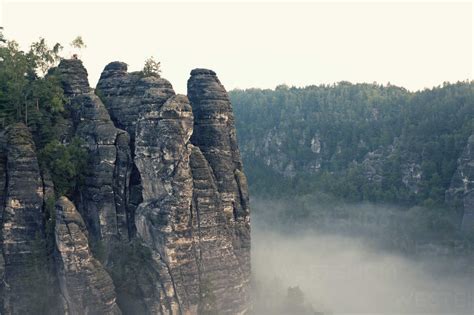Germany Saxony Morning Mist At Elbe Sandstone Mountains Stock Photo