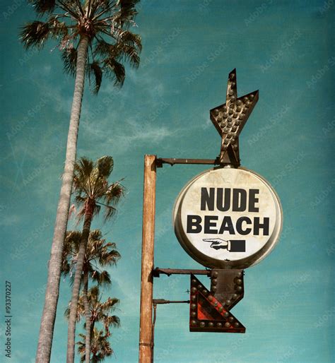 Aged And Worn Vintage Photo Of Nude Beach Sign With Palm Trees Photos