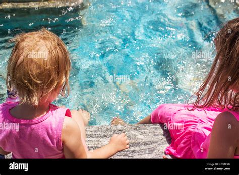 Cute Little Kids Sitting Poolside Hi Res Stock Photography And Images