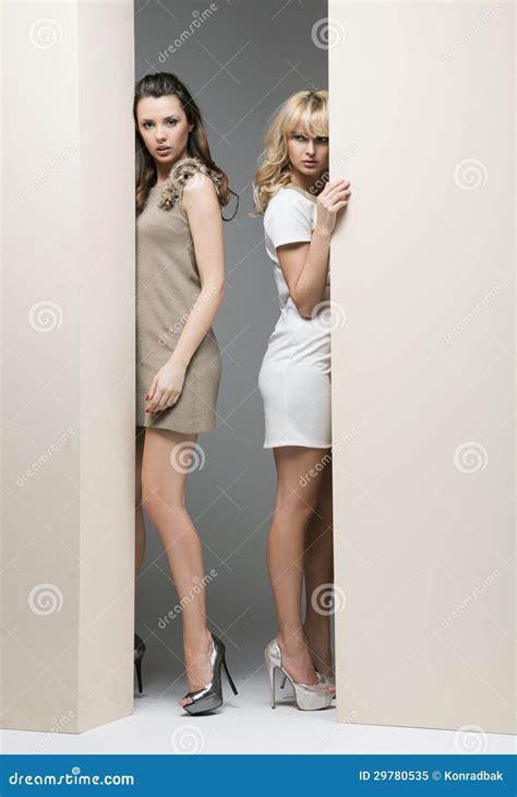 Attractive Women Hiding Theirselves Behind The Wall Royalty Free Stock