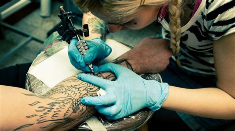 think before you ink law may put a 24 hour waiting period on tattoos piercings abc news