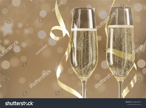 Champagne Glasses Gold Bokeh Background Stock Photo 1888959847
