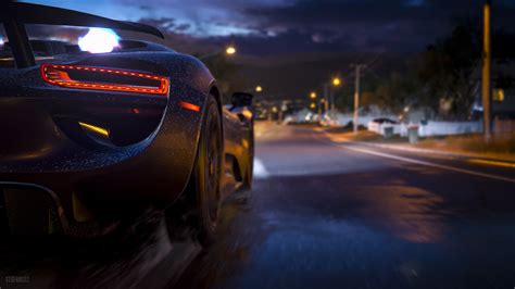 Time Lapsed Photography Of Black Luxury Car On Asphalt Road During