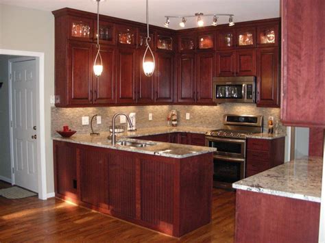 It is then covered with a resin and paper finish that can be manufactured to embody various styles and colours. Cherry Wood Cabinets Kitchen - Home Furniture Design