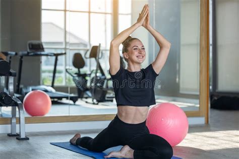 Woman In An Athletic Look With Aerobic Exercise Stretching Loose Young