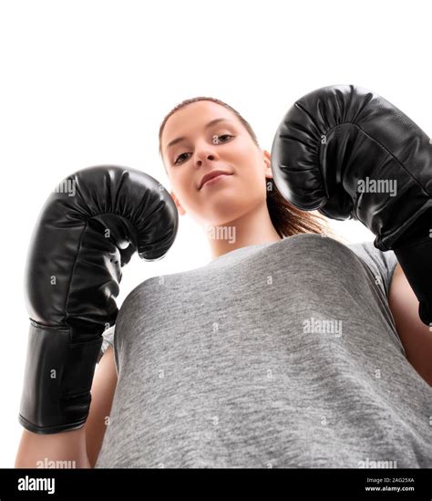 Bottom Up Portrait Of A Beautiful Young Woman With Boxing Gloves In A