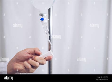 Close Up Saline Iv Drip Infusion Doctor Adjusted Volume Rate Of
