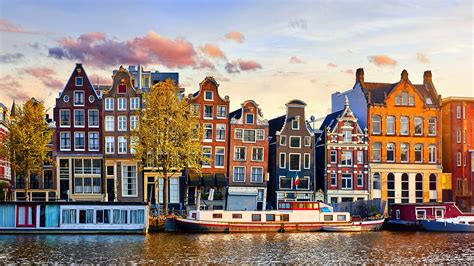 Grachtenhäuser An Der Amstel In Amsterdam Home Of Travel