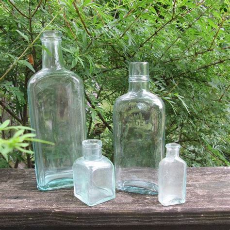 Four Vintage Pale Green Glass Bottles Apothecary Etsy Green Glass Bottles Glass Bottles