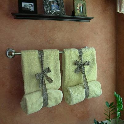 Depending on the color scheme of your bathroom, purchase or find some colored bottles. ways to display bathroom towels - Google Search | Home ...