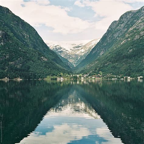 View To The Mountain Tops With Reflection On The Norwegian Fjords By