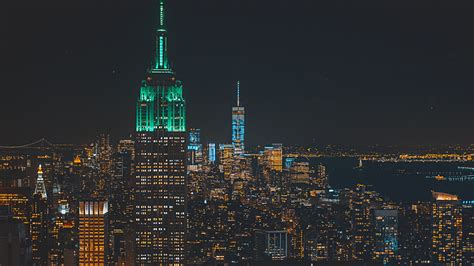 View Of The Empire State Building With A Nyc Skyline Lit Up At Night