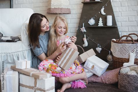 two girls give each other ts hugs preparation for christmas decoration decor lifestyle