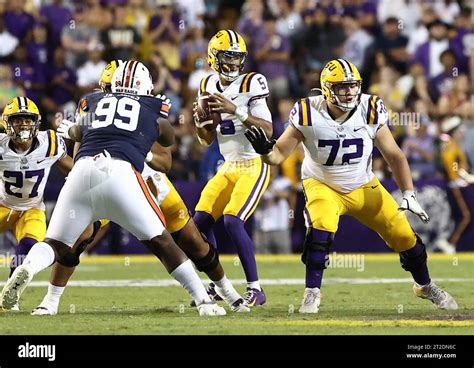 Lsu Tigers Quarterback Jayden Daniels Looks Downfield For An Open Receiver During A