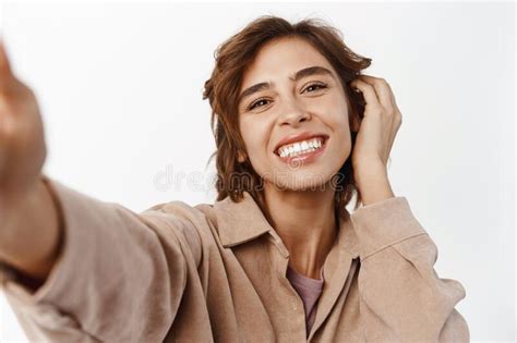 Close Up Portrait Of Smiling Brunette Girl Taking Selfie Touching Her