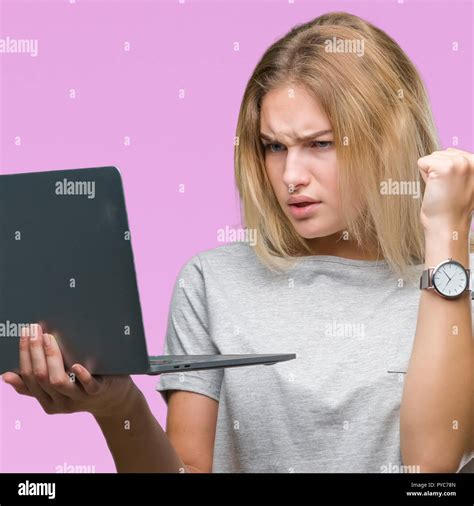 Young Caucasian Woman Using Computer Laptop Over Isolated Background