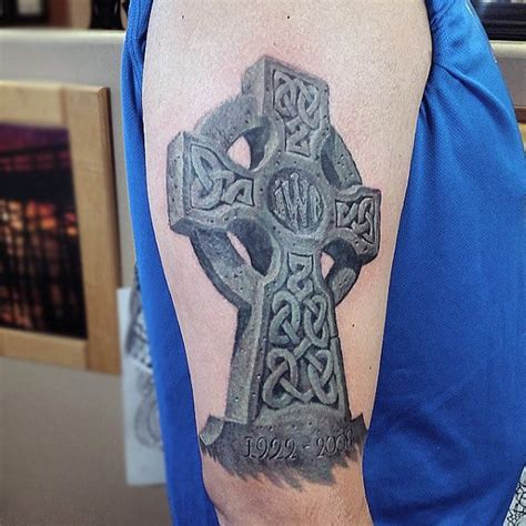 This tattoo consists of a celtic cross with a ring enclosing it. 100 Celtic Cross Tattoos For Men - Ancient Symbol Design Ideas