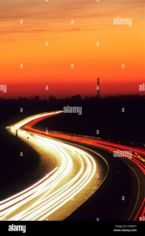 Traffic Light Trails On Motorway At Dusk Stock Photo Alamy