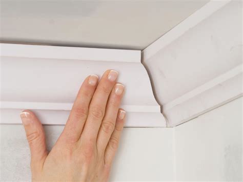 Installing ceiling mouldings to the corners of a flat ceiling. How to Install Crown Molding