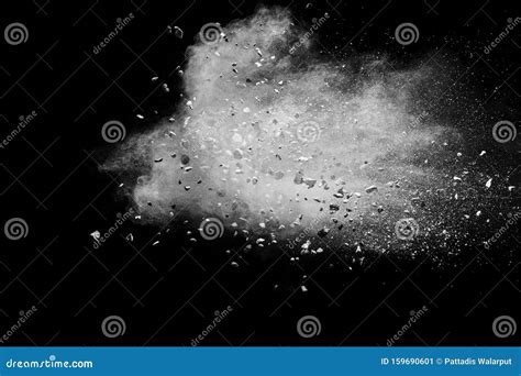 Split Debris Of Stone Exploding With White Powder Against Black