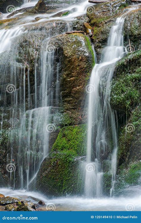 Close Up Of Waterfall Cascade Over The Mossy Rock Stock Photo Image