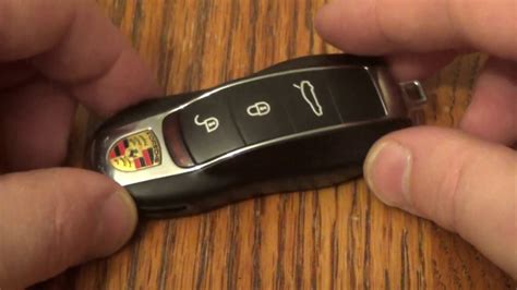 Remove the physical key from the fob and use it to pry the fob apart. Porsche Panamera Key Fob