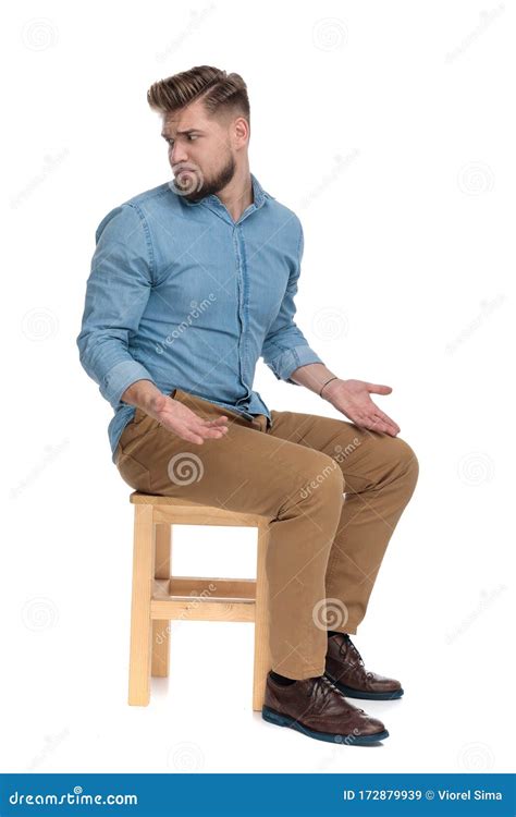 Confused Casual Guy Asking Questions And Looking To Side Stock Image