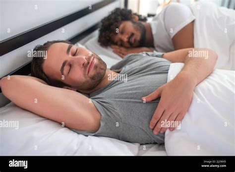 Gay Couple Lying In Bed During The Morning Sleep Stock Photo Alamy